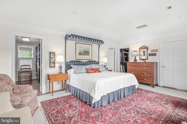 809 Cornell St, Fredericksburg, VA 22401 - bedroom featuring visible vents, crown molding, carpet, and a walk in closet
