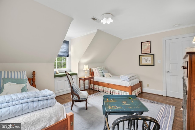 809 Cornell St, Fredericksburg, VA 22401 - bedroom featuring visible vents, vaulted ceiling, wood finished floors, baseboards, and ornamental molding