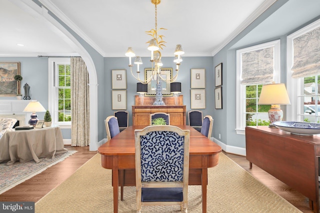 809 Cornell St, Fredericksburg, VA 22401 - dining area with arched walkways, baseboards, a chandelier, and wood finished floors