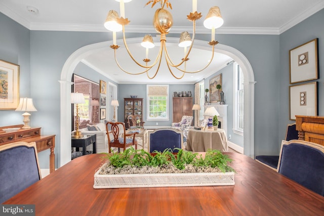 809 Cornell St, Fredericksburg, VA 22401 - dining space with crown molding, arched walkways, a chandelier, and wood finished floors