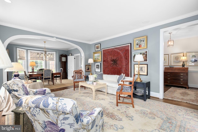 809 Cornell St, Fredericksburg, VA 22401 - living area featuring arched walkways, a chandelier, ornamental molding, and wood finished floors