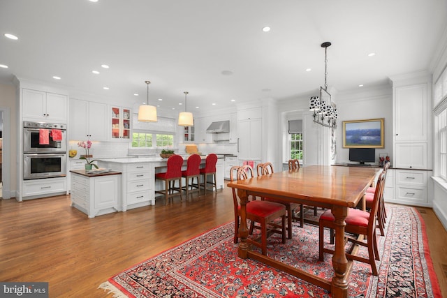 809 Cornell St, Fredericksburg, VA 22401 - dining area with recessed lighting, ornamental molding, dark wood finished floors, and a chandelier