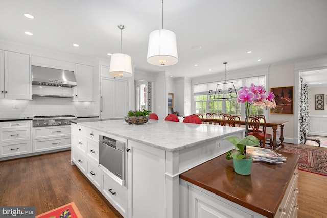 809 Cornell St, Fredericksburg, VA 22401 - kitchen with wall chimney range hood, crown molding, stainless steel gas cooktop, and tasteful backsplash