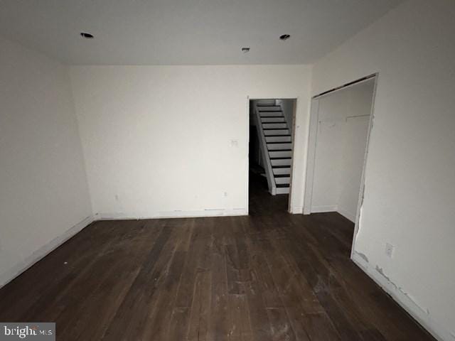 unfurnished bedroom featuring a closet and wood finished floors