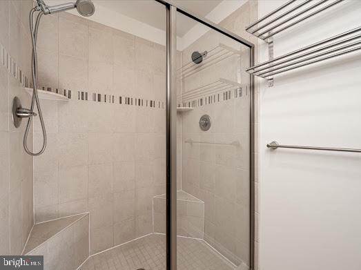 bathroom featuring a shower stall