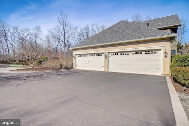 garage featuring driveway