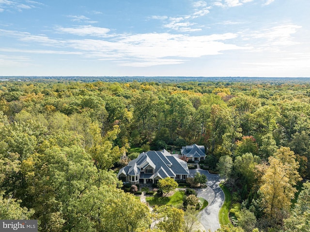 drone / aerial view featuring a view of trees