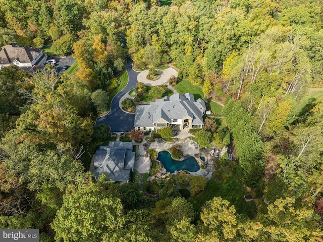 drone / aerial view with a view of trees