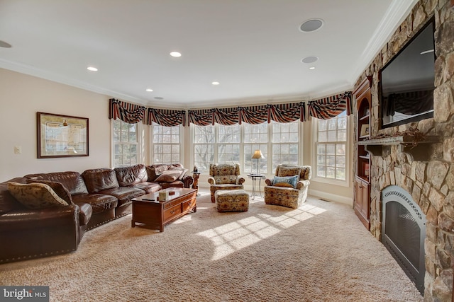 living room with recessed lighting, light colored carpet, crown molding, and a stone fireplace