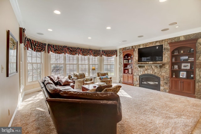 living area with carpet floors, baseboards, ornamental molding, and a stone fireplace