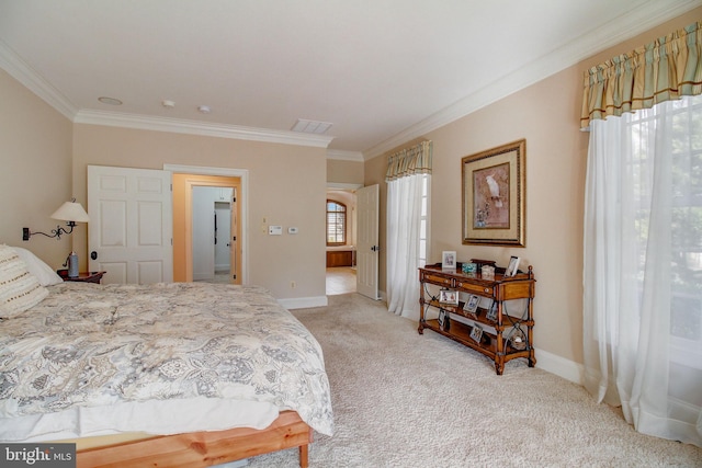 bedroom featuring multiple windows, crown molding, and light colored carpet