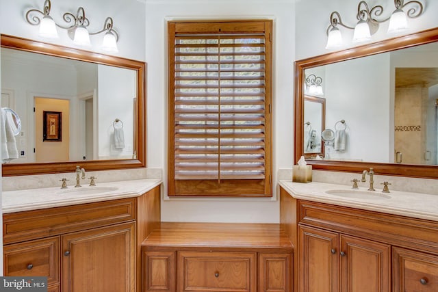 full bathroom with plenty of natural light, two vanities, and a sink