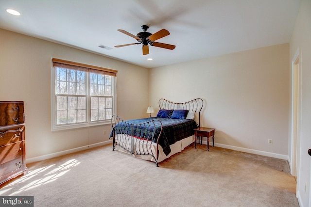 carpeted bedroom with a ceiling fan, recessed lighting, visible vents, and baseboards