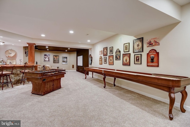 game room featuring light carpet, a dry bar, baseboards, and recessed lighting