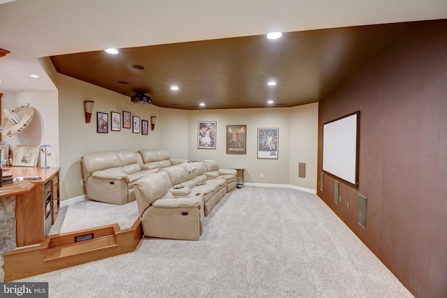 carpeted cinema with baseboards and recessed lighting