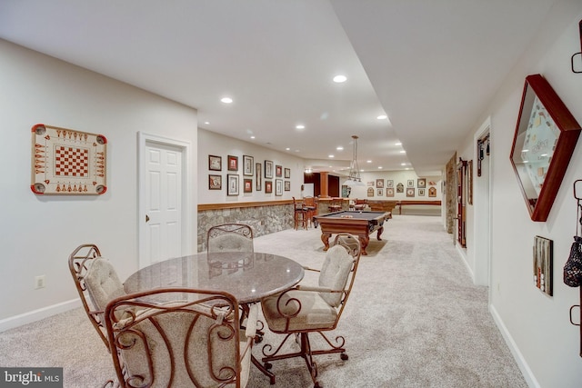 dining room featuring carpet floors, recessed lighting, bar, and baseboards