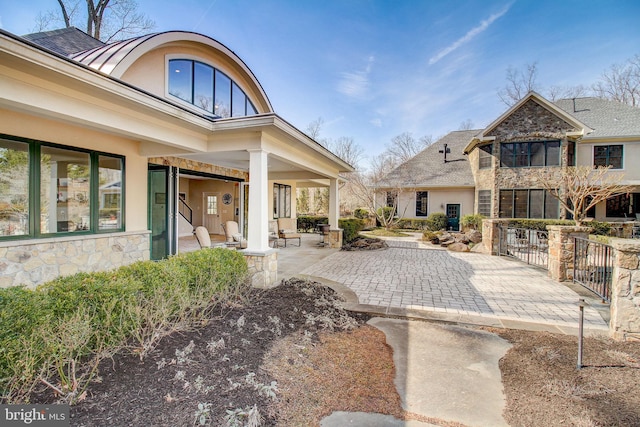 surrounding community with a patio area and fence