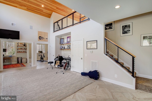 foyer featuring recessed lighting, visible vents, stairway, and baseboards