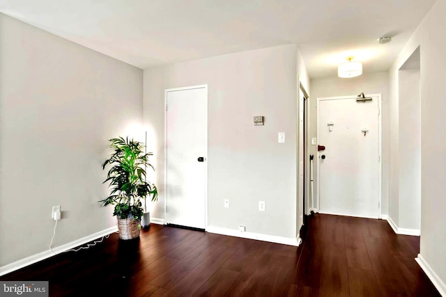 entrance foyer with wood-type flooring and baseboards