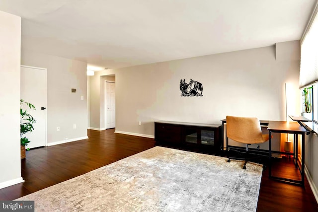 office space featuring wood-type flooring and baseboards