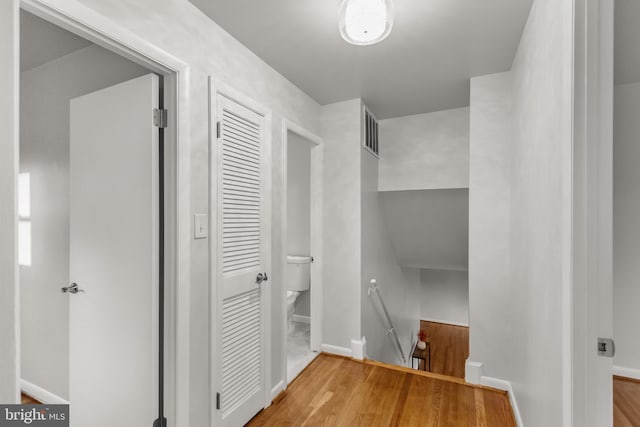 interior space with visible vents and wood finished floors