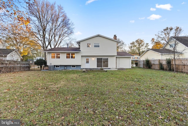 back of house featuring a lawn, a chimney, a fenced backyard, and cooling unit