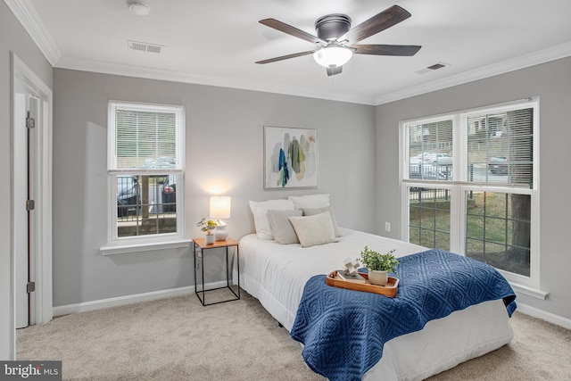 carpeted bedroom with ornamental molding, visible vents, and baseboards