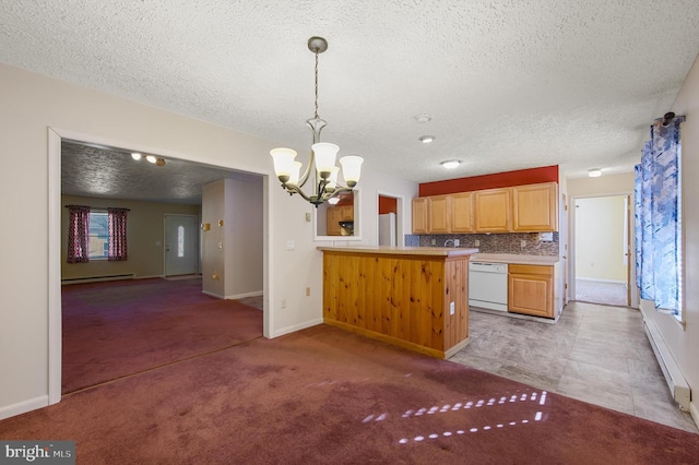 kitchen with light countertops, a baseboard heating unit, freestanding refrigerator, dishwasher, and a peninsula