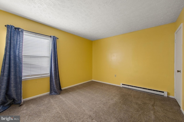 empty room featuring carpet floors, baseboards, baseboard heating, and a textured ceiling