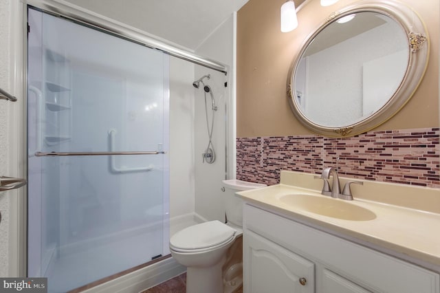 full bath featuring toilet, a shower stall, decorative backsplash, and vanity