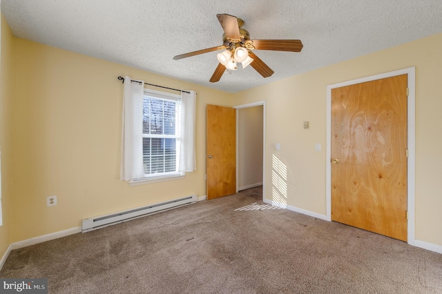 unfurnished bedroom featuring baseboards, a ceiling fan, a textured ceiling, carpet floors, and a baseboard heating unit