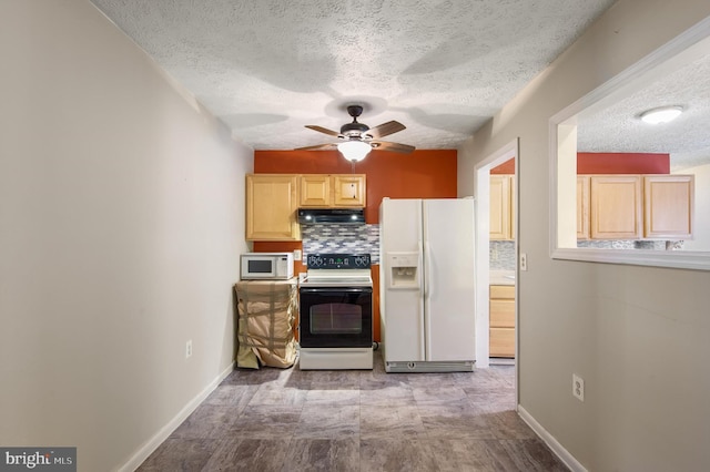 kitchen with ceiling fan, under cabinet range hood, white appliances, baseboards, and tasteful backsplash