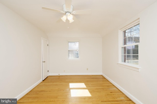 unfurnished room with light wood-type flooring, ceiling fan, and baseboards