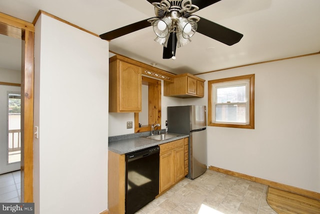 kitchen featuring baseboards, a ceiling fan, dishwasher, freestanding refrigerator, and a sink