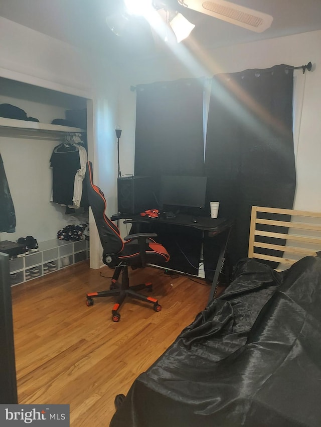 bedroom featuring a closet and wood finished floors