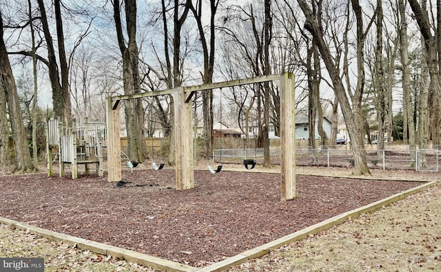 community jungle gym featuring fence