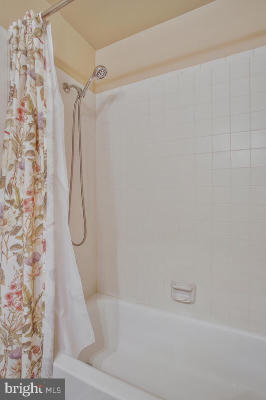 full bath featuring shower / bath combination with curtain