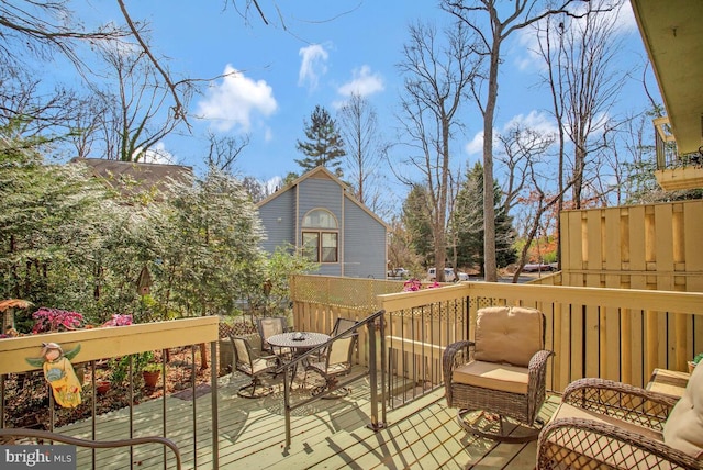 deck featuring outdoor dining area