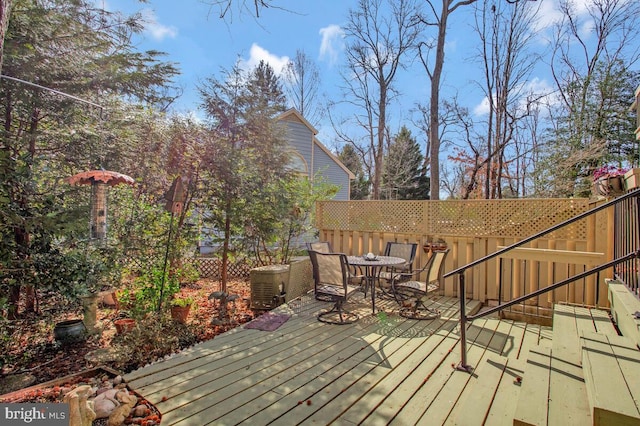 wooden deck featuring outdoor dining space