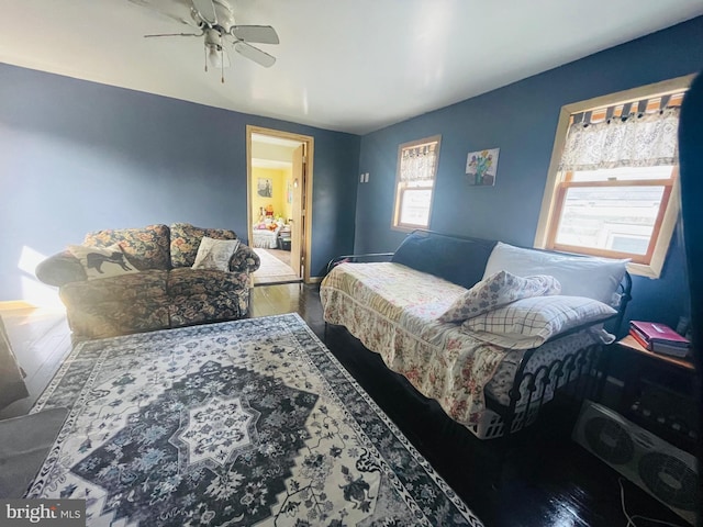 bedroom featuring wood finished floors and a ceiling fan