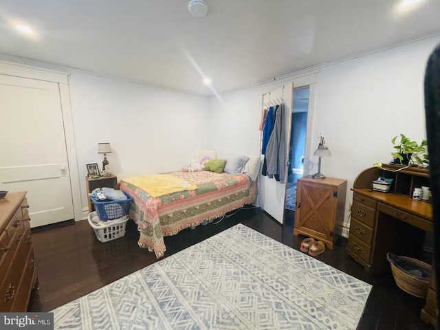 bedroom with dark wood-style floors