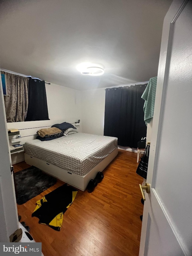 bedroom with wood finished floors