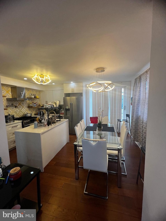 dining area featuring dark wood-type flooring