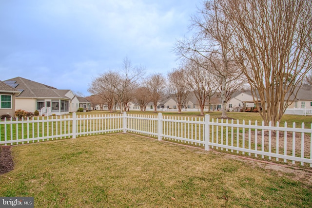 view of yard featuring fence private yard and a residential view