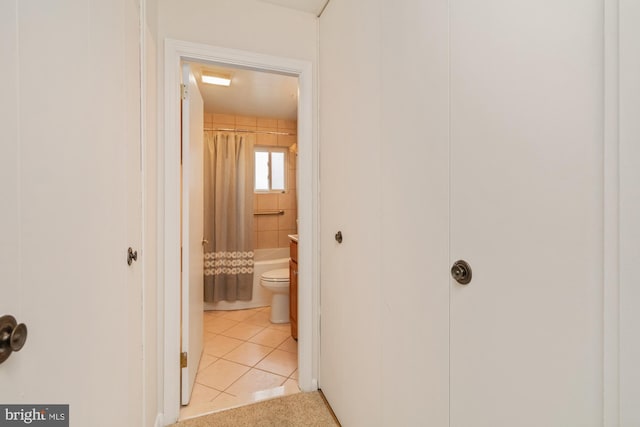 hallway featuring light tile patterned flooring