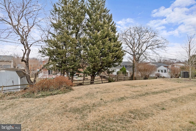 view of yard with fence and a residential view