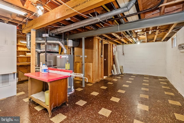 unfinished below grade area with tile patterned floors and water heater