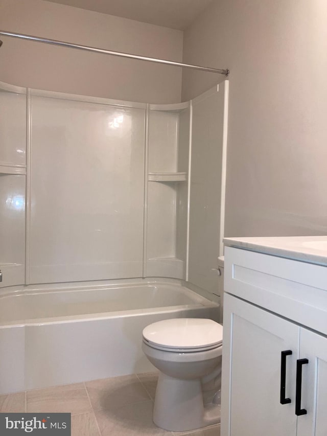 full bathroom with toilet, tile patterned floors, tub / shower combination, and vanity