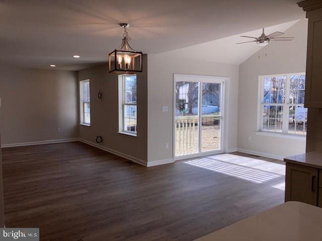 unfurnished dining area featuring vaulted ceiling, baseboards, dark wood finished floors, and recessed lighting