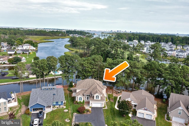 bird's eye view with a water view and a residential view